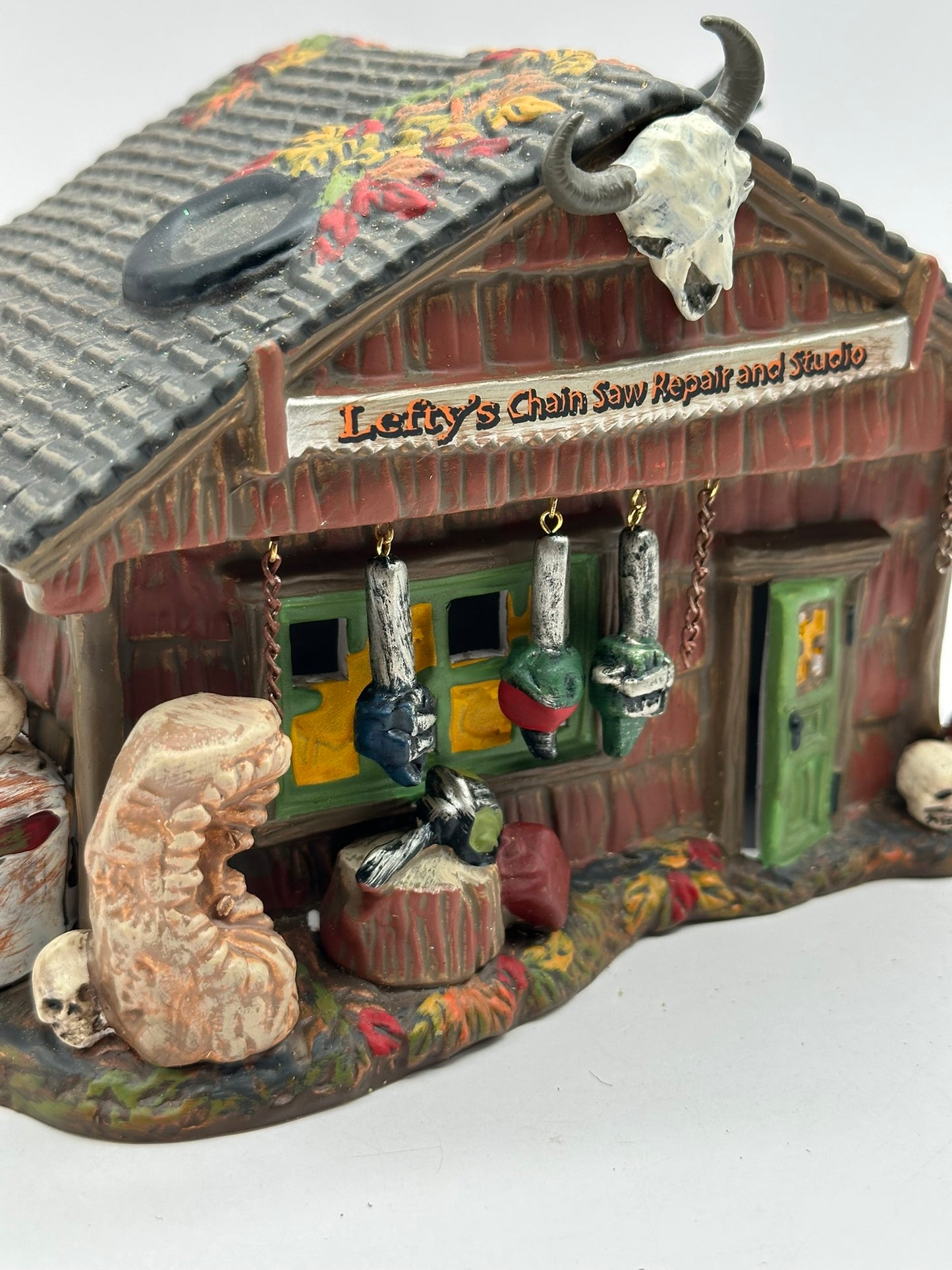 Department 56 - Lefty’s Chain Saw Repair and Studio - Snow Village Halloween