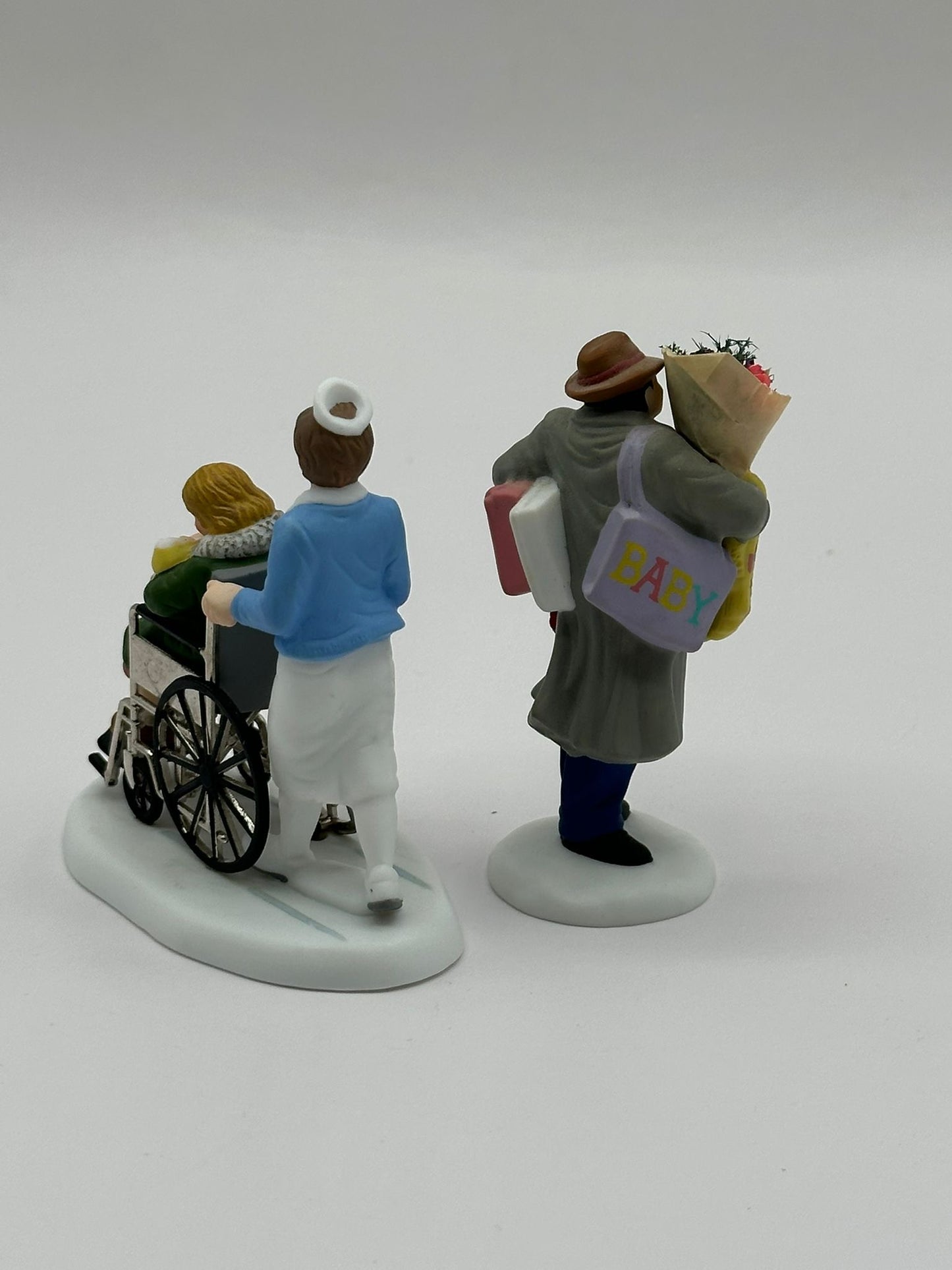 Department 56 - Bringing Home The Baby - Christmas in the City