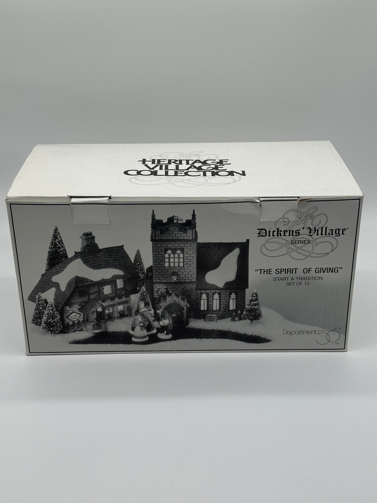 Outer box front: The Spirit of Giving, Dickens' Village Series, Department 56